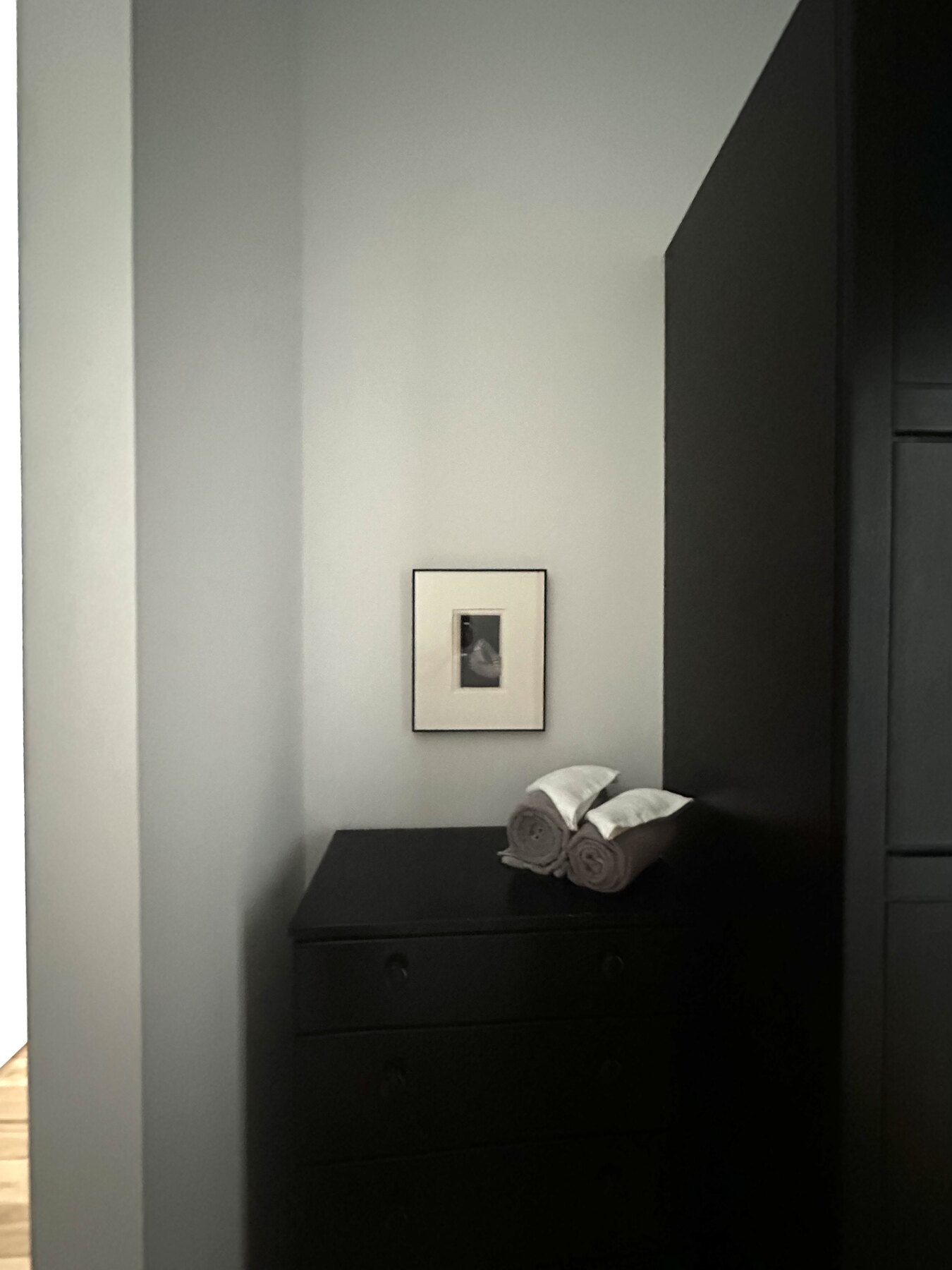 A framed work installed in an interior at E1507.